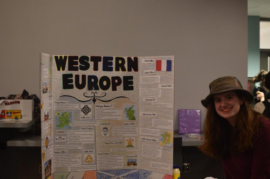 Sarah Ryan posing with her poster of Western Europe.