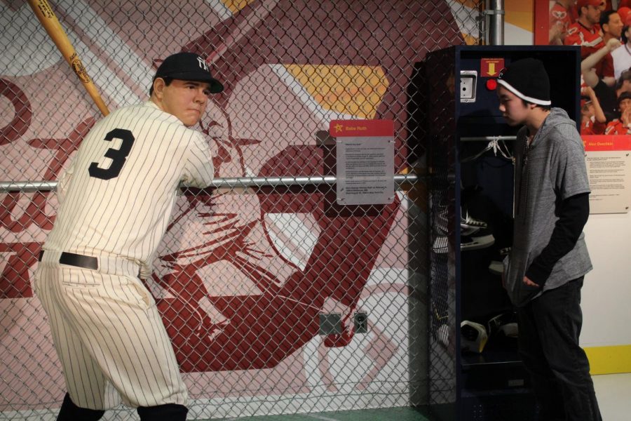 Anthony Nguyen sizes up a wax figure of Babe Ruth at Madame Tussauds