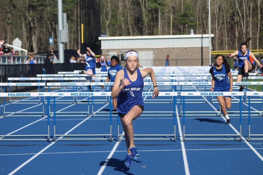 Ruby Ambroult finishes the 100 meter hurdles