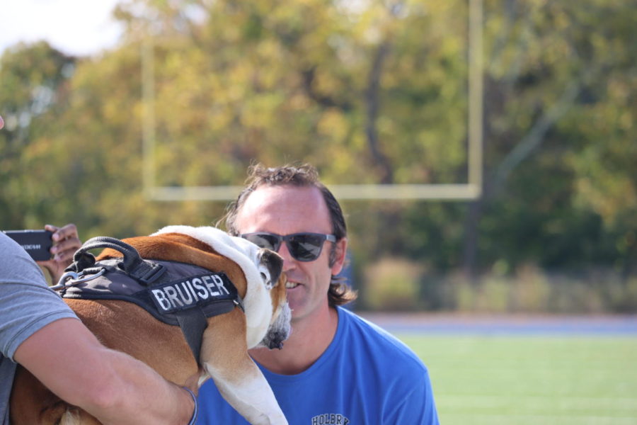 Mr. Case kissing Bruiser the Bulldog