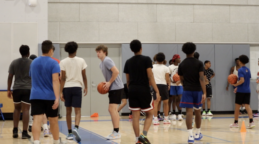 Players+head+to+the+baseline+during+boys+basketball+tryouts+last+week.