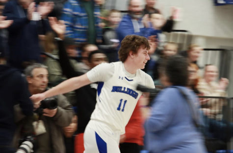 Owen Burke after scoring his 1,000th point
