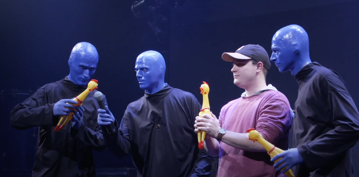 The Blue Man Group brings some audience members for some interactive fun!