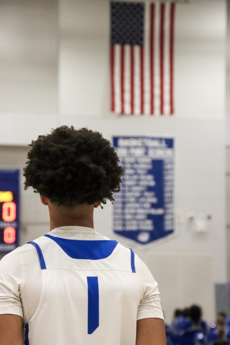 Allen Brown Looks the 1000 point scorers banner prior to tip off in the game he puts his name on that list. 