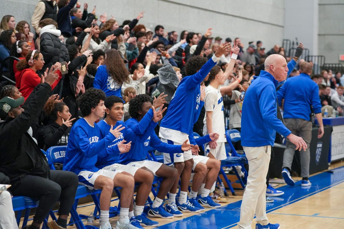 Holbrook players, as well as the fans, raised three fingers from the bench after Allen Brown Jr. hit a 3-pointer to reach 2,000 career points. This was a historic moment for the bulldogs.