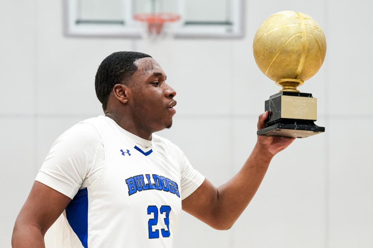 Odens Massillion poses with his trophy after hitting 1000 career points for Holbrook